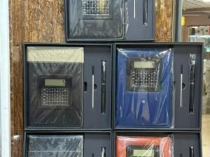 Notebook with rotating calculator and pen