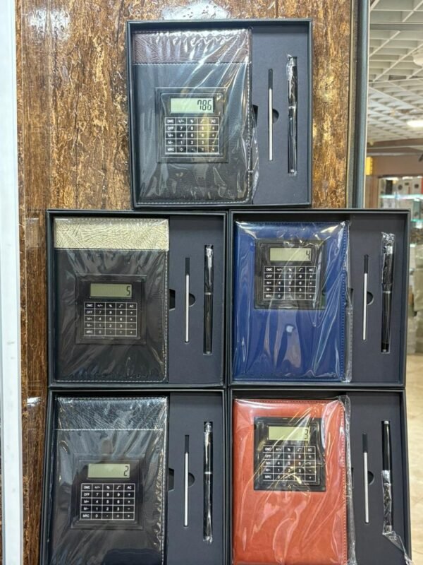 Notebook with rotating calculator and pen